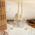 Crystal Butterfly Pendant Necklace with Pearl Accents